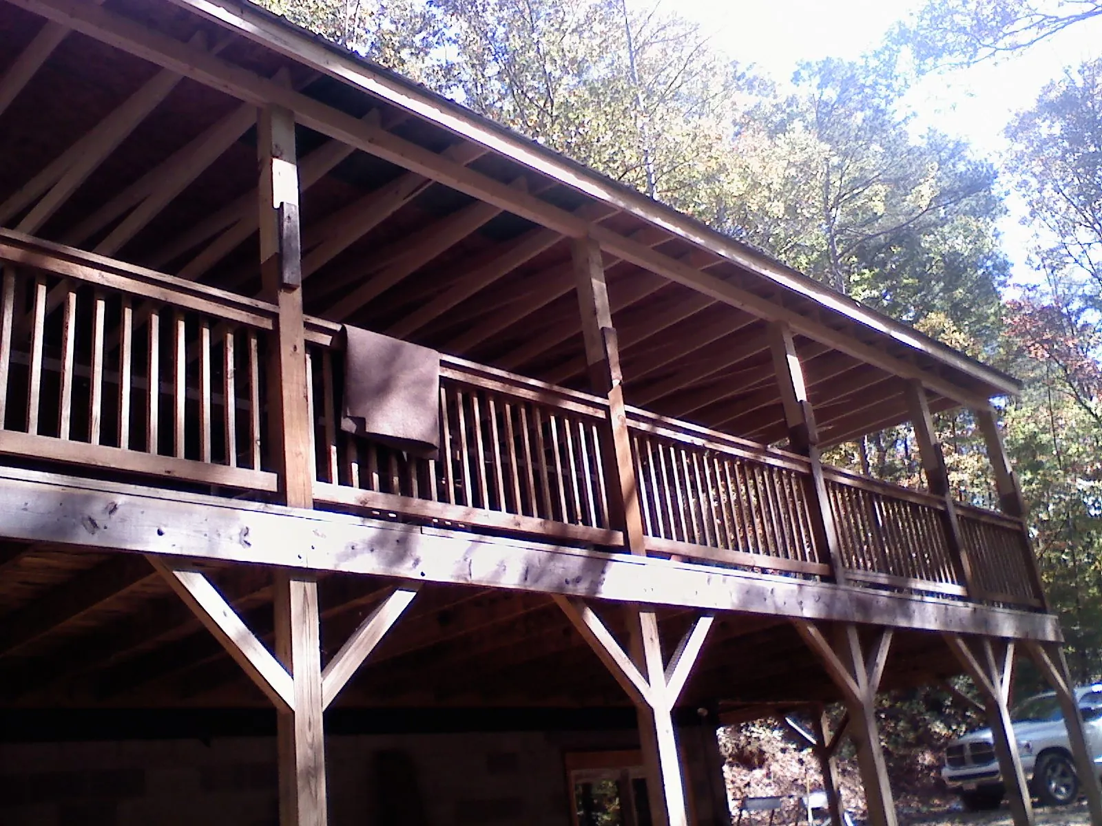 Timber framing under a new elevated porch and deck — Roof Leak Repair in Detroit by Roofing Brothers